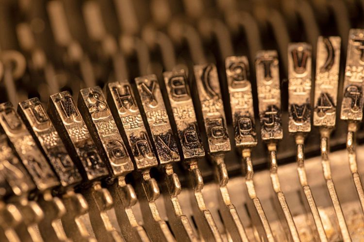 close-up-metallic-typesetting-letters